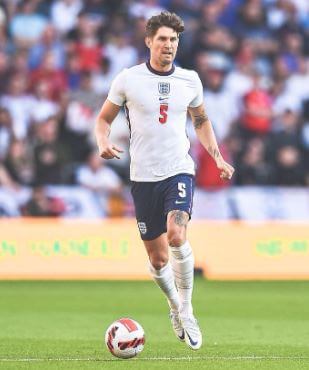 Janet Stones son John Stones in the field.